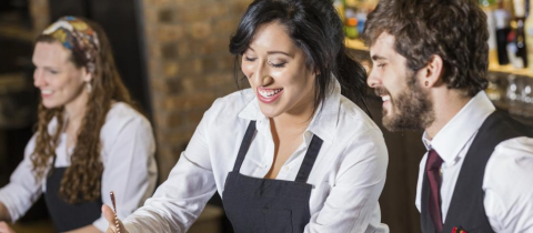Smiling servers at restaurant